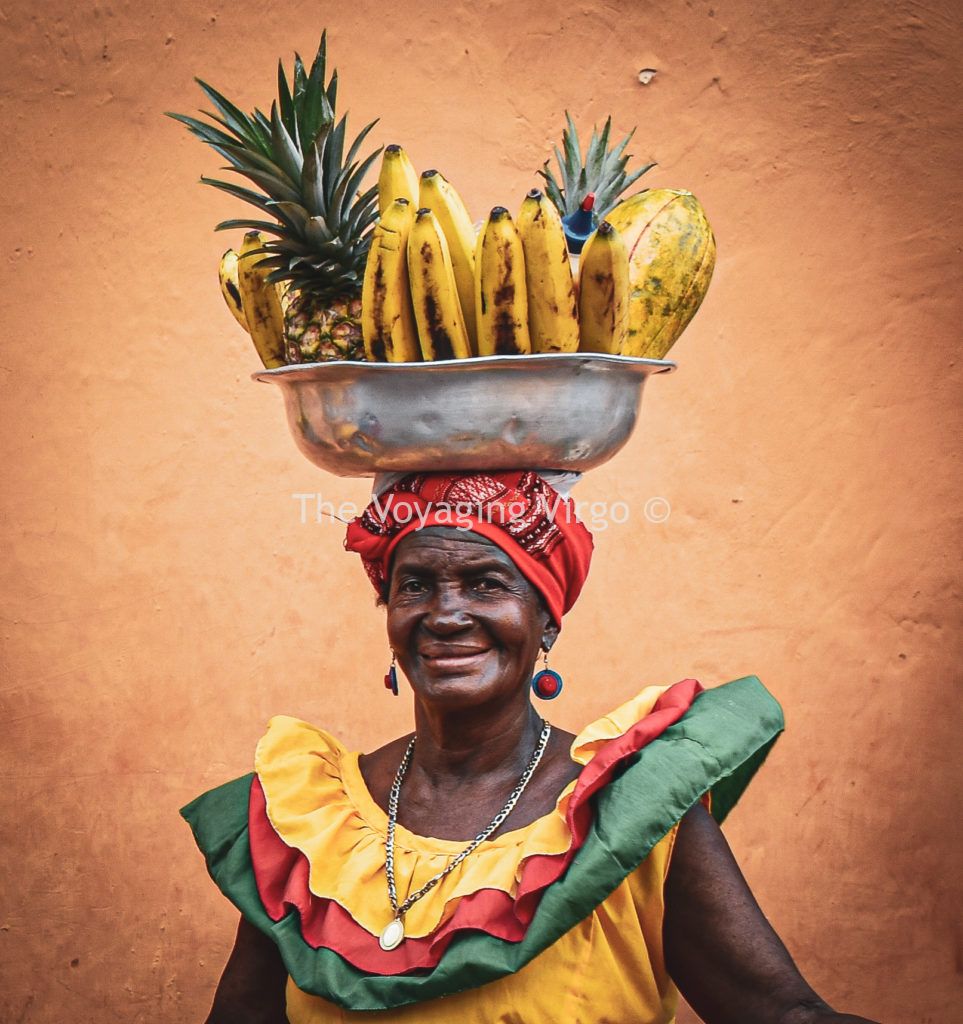 A colourfully dressed Palenquera in Cartagena, Colombia.